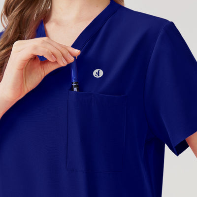 Uniforme médico de mujer azul real con múltiples bolsillos