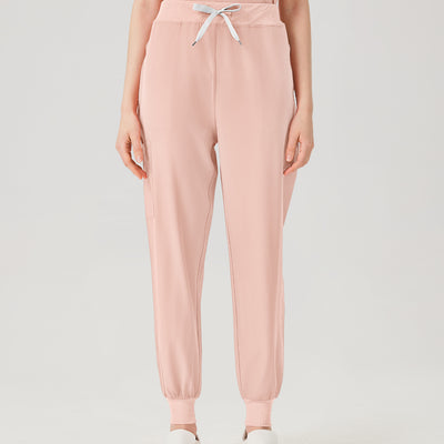 Vista frontal de los pantalones del uniforme médico de mujer de color rosa.