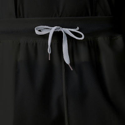 Bata quirúrgica negra JelriSoFit® para hombre, pantalones mostrados al frente