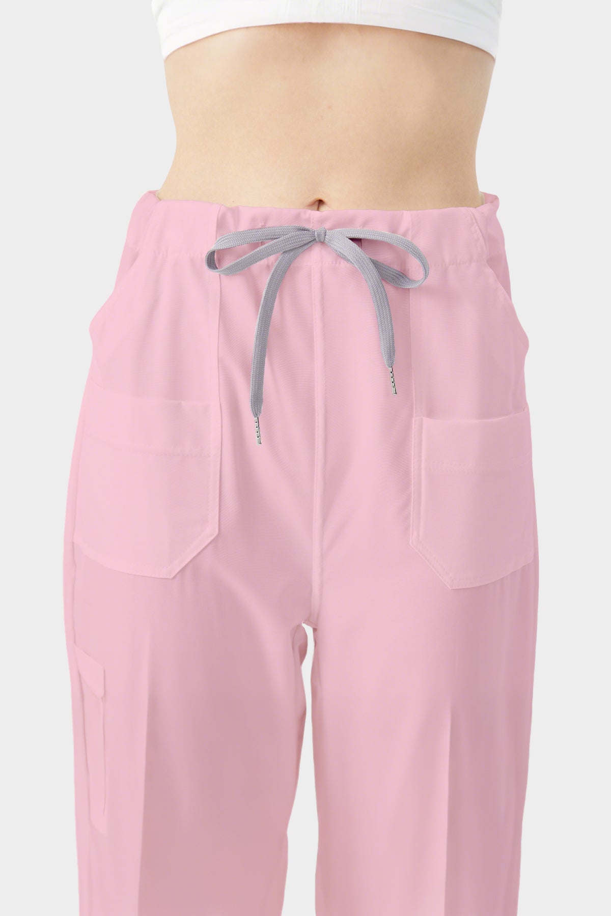 Bata quirúrgica rosa de mujer con pantalones que muestran la vista frontal