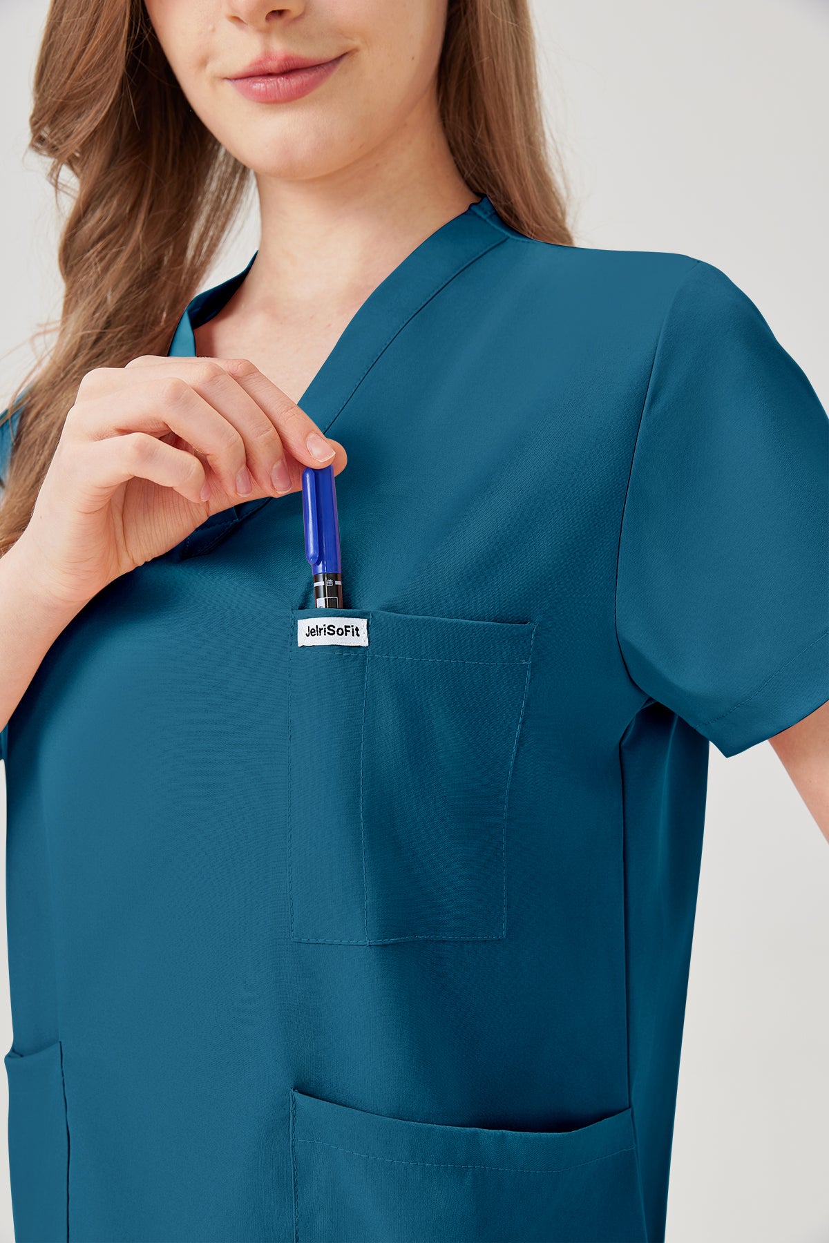 Bata quirúrgica azul cielo para mujer JelriSoFit® con bolsillos multifunción