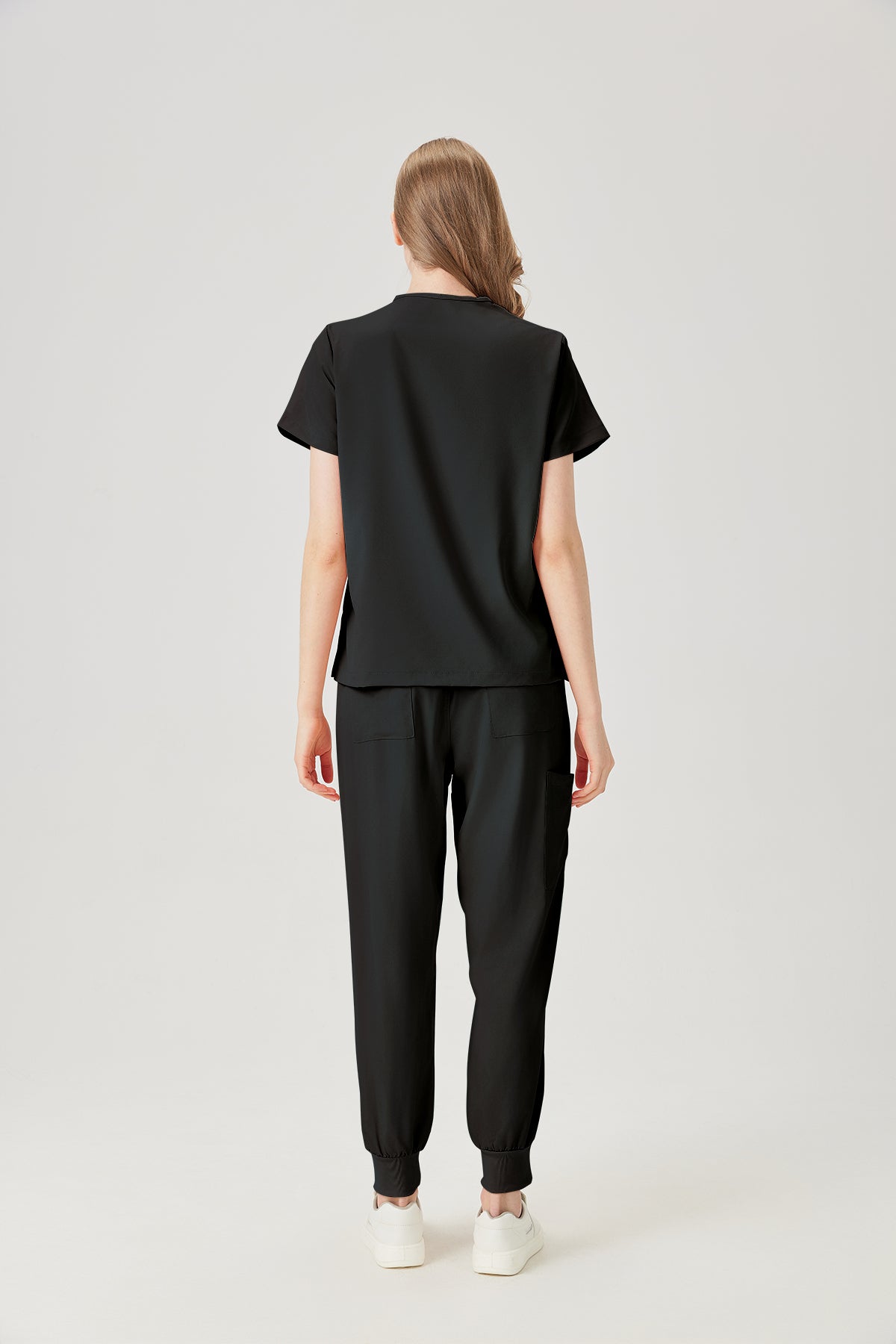 Bata quirúrgica negra para mujer JelriSoFit® (vista posterior)