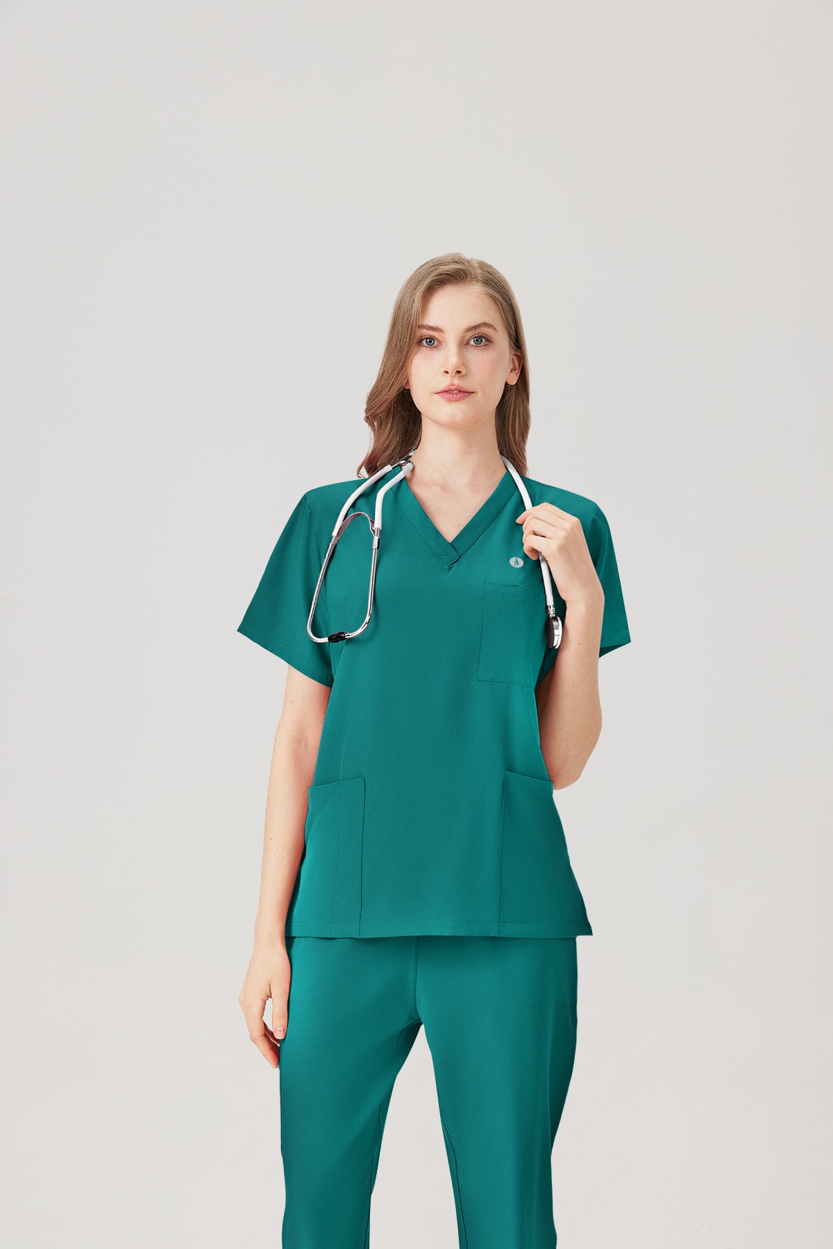 Uniforme médico femenino verde esmeralda, exhibición superior