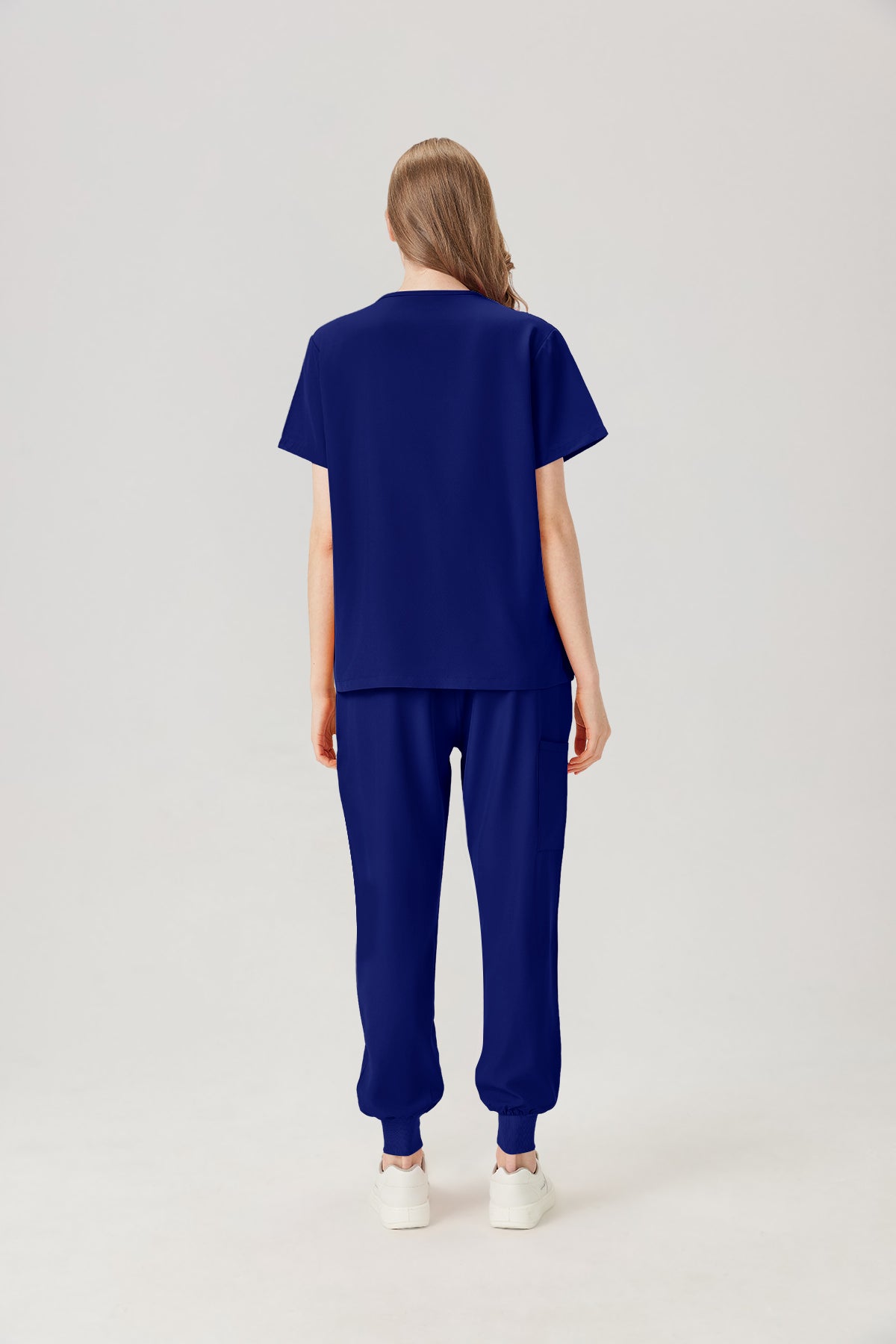 Uniforme médico femenino azul real, vista posterior