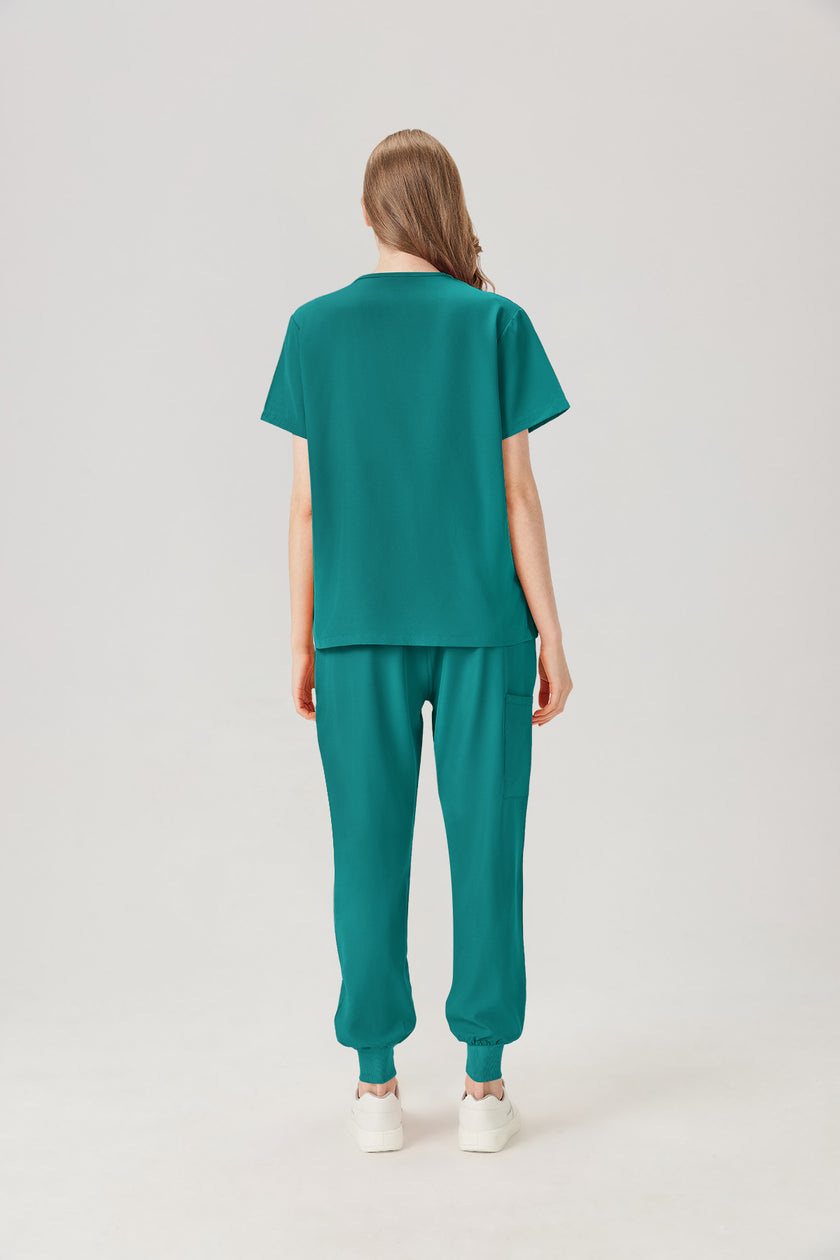 Uniforme médico femenino verde esmeralda, vista posterior