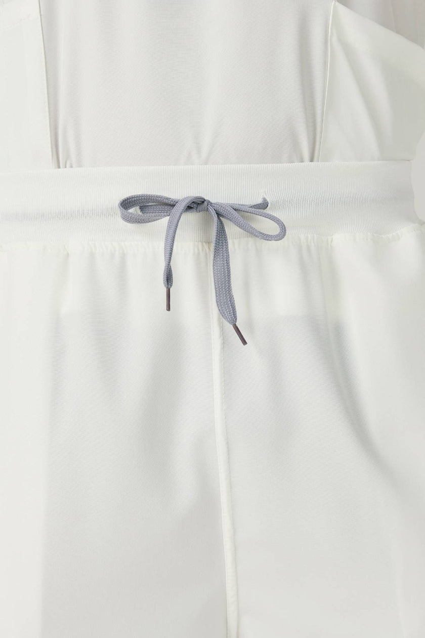 Bata quirúrgica JelriSoFit® para hombre - Crema, vista frontal del pantalón
