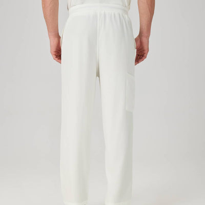 Bata quirúrgica para hombre JelriSoFit® - Crema, vista posterior del pantalón

